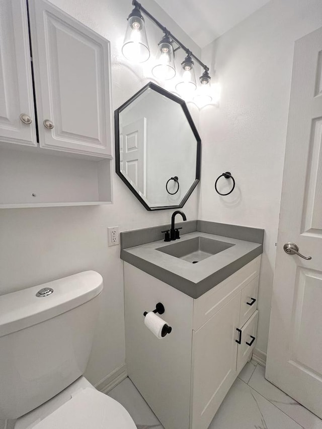 bathroom with vanity and toilet