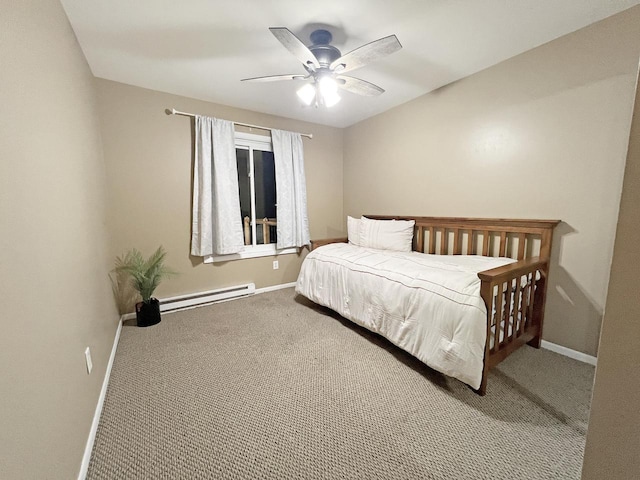 carpeted bedroom with ceiling fan and baseboard heating