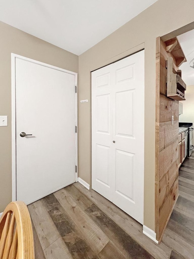 interior space with dark hardwood / wood-style floors