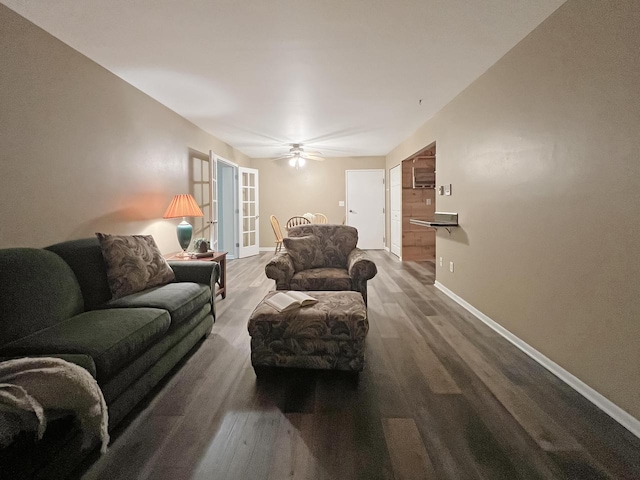 living room with hardwood / wood-style flooring and ceiling fan