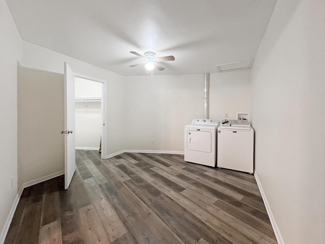 washroom with dark hardwood / wood-style flooring, washing machine and dryer, and ceiling fan