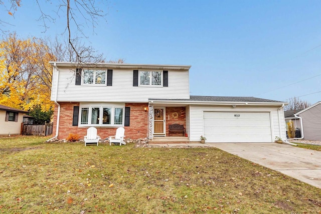 view of front property featuring a front yard and a garage