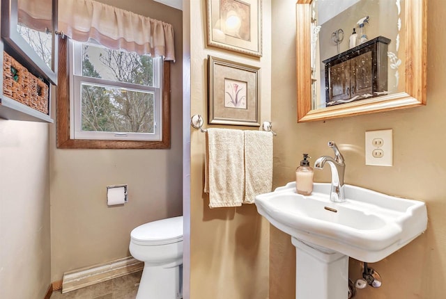 bathroom featuring tile patterned floors, toilet, and sink