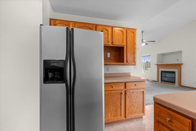 kitchen featuring light carpet, stainless steel fridge, and ceiling fan