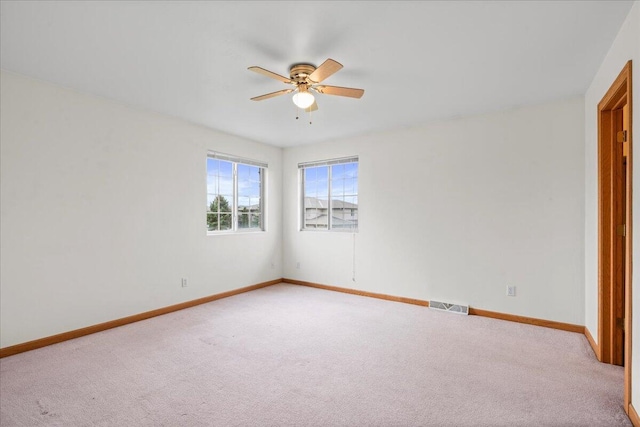 unfurnished bedroom featuring ceiling fan and carpet