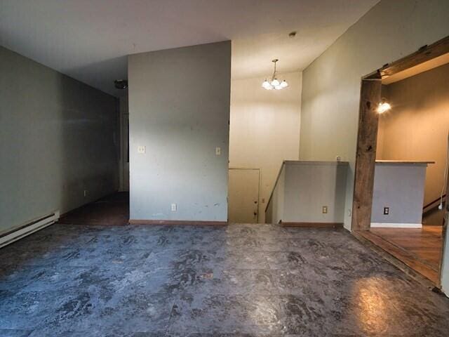 unfurnished room with a chandelier and lofted ceiling