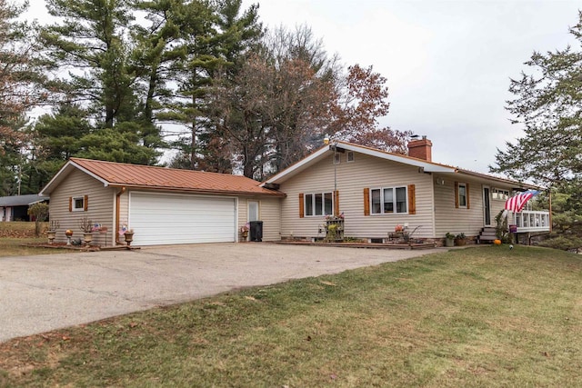 ranch-style home with a front lawn and a garage