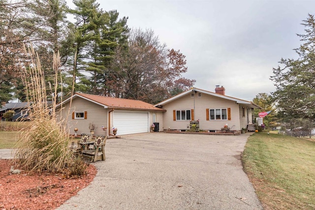 ranch-style house with a front yard and a garage