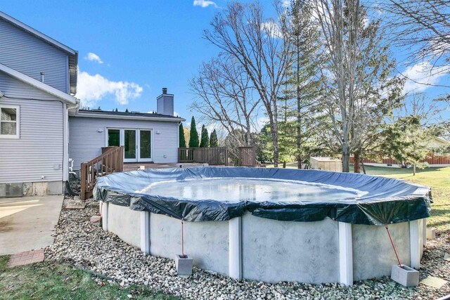 view of pool featuring a wooden deck