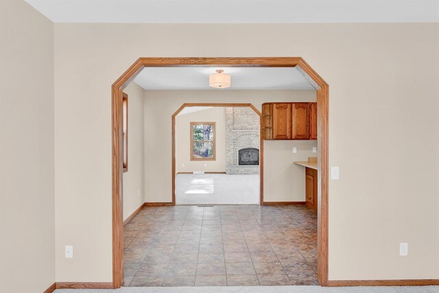 kitchen with a brick fireplace