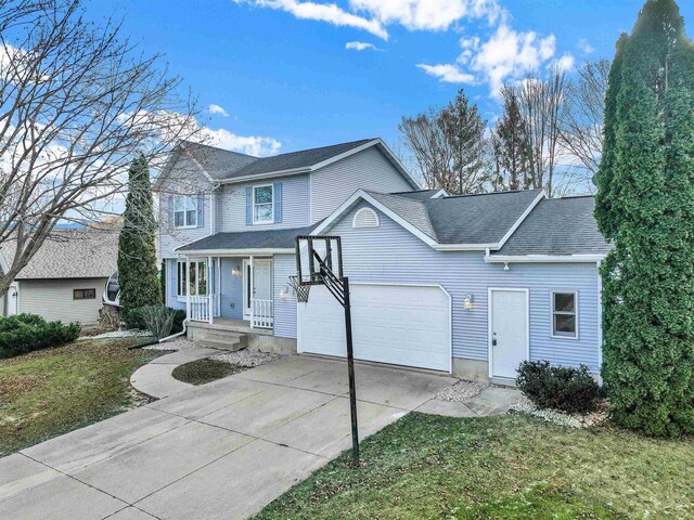 view of front property with a front yard and a garage