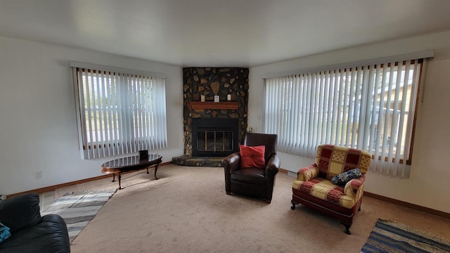 living room featuring carpet flooring and a fireplace