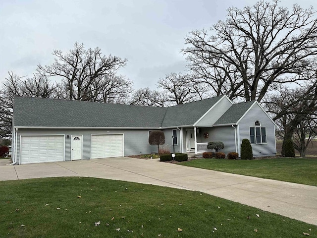 single story home featuring a front lawn and a garage