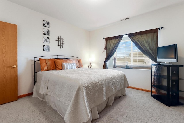 bedroom with light colored carpet