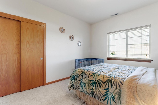 carpeted bedroom featuring a closet