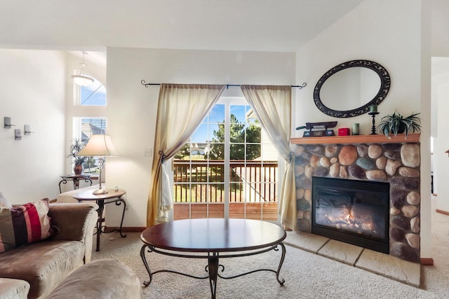 carpeted living room featuring a fireplace