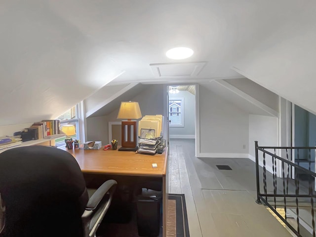 office featuring light hardwood / wood-style floors and lofted ceiling