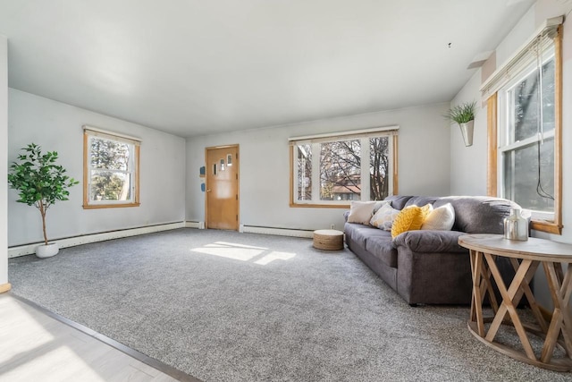 living room featuring light carpet, a baseboard radiator, and a wealth of natural light