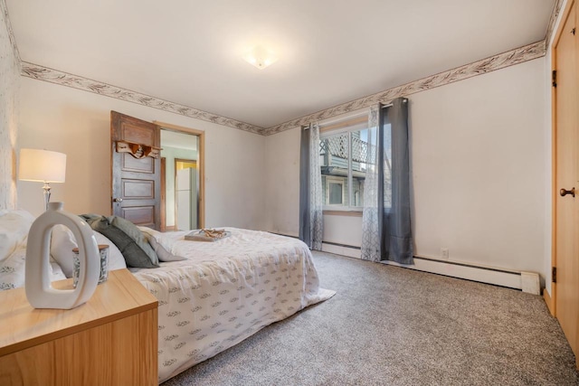 carpeted bedroom featuring baseboard heating