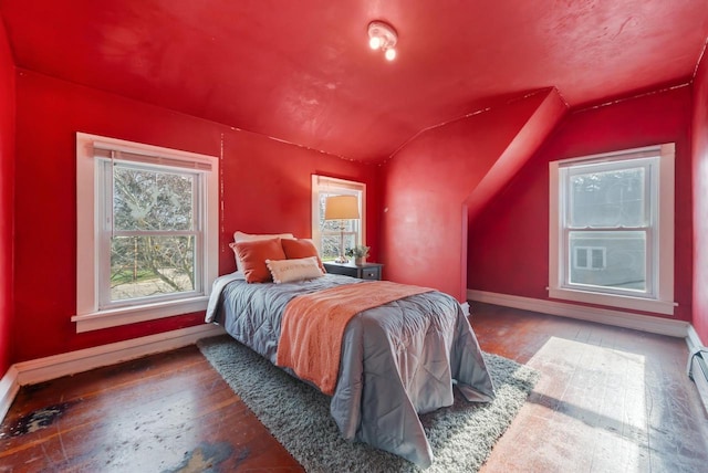 bedroom featuring dark hardwood / wood-style floors and lofted ceiling