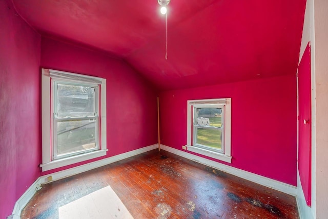 bonus room featuring hardwood / wood-style flooring and vaulted ceiling