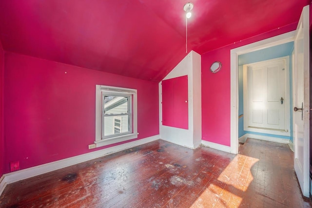 additional living space with lofted ceiling and dark wood-type flooring