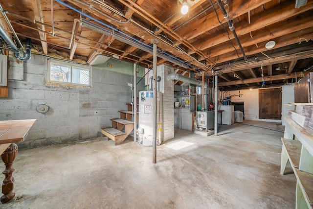 basement featuring heating unit, washer / dryer, and water heater