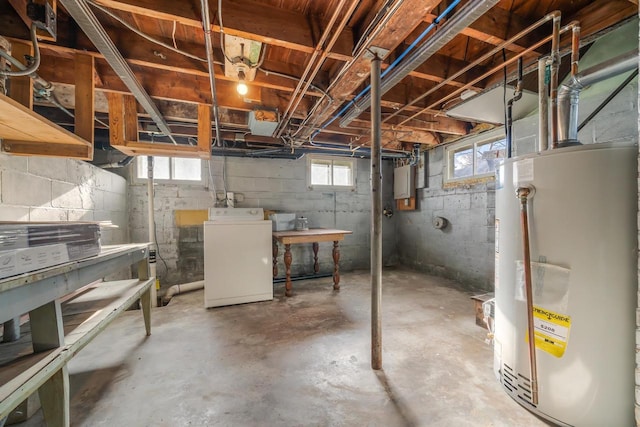 basement featuring gas water heater and washer / clothes dryer