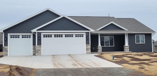 craftsman house featuring a garage