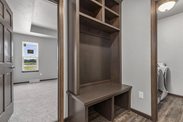 mudroom with washer and clothes dryer and dark hardwood / wood-style floors