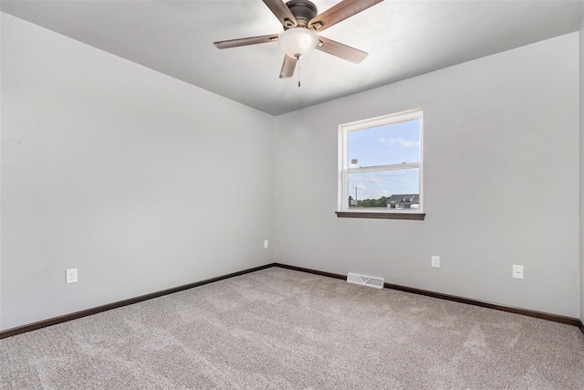 empty room with carpet floors and ceiling fan