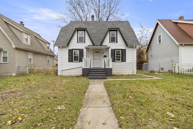 bungalow-style house with a front lawn