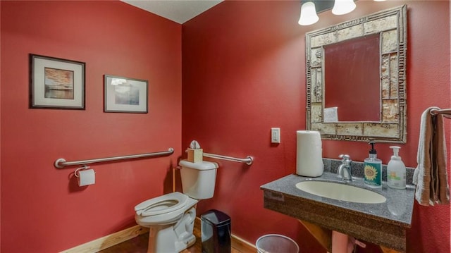 bathroom featuring sink and toilet