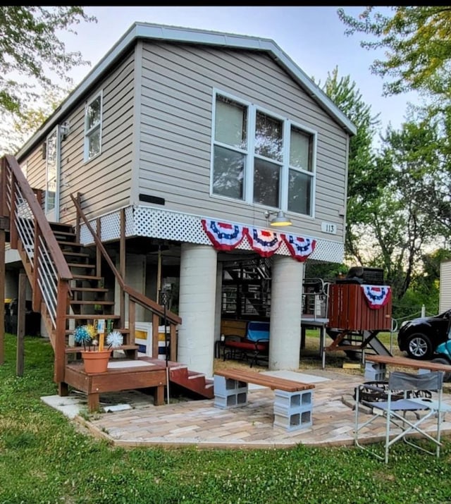 back of property featuring a patio