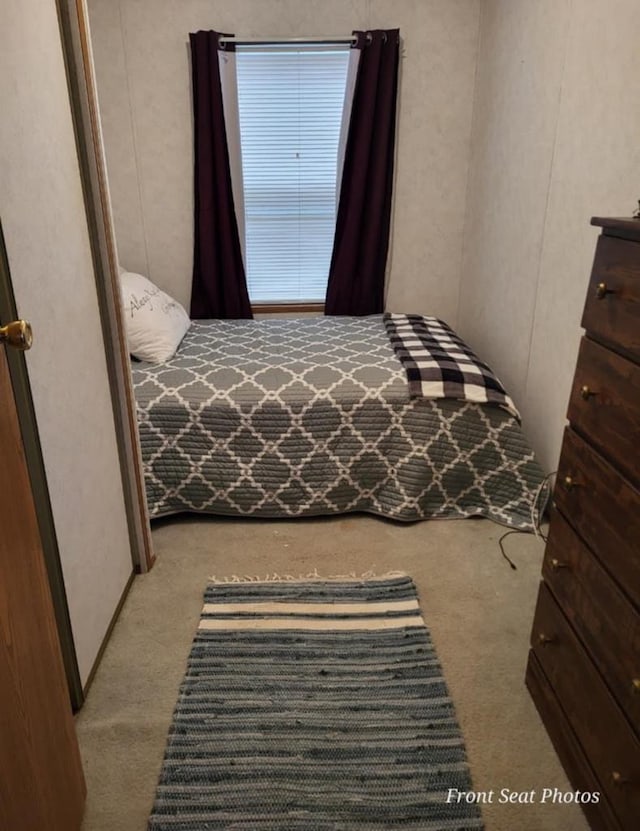 unfurnished bedroom featuring light colored carpet