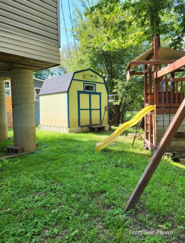 view of yard featuring a shed and a playground