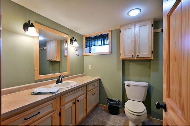 bathroom with vanity and toilet