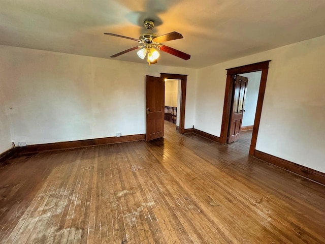 unfurnished room with hardwood / wood-style floors and ceiling fan