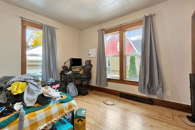 bedroom with hardwood / wood-style floors