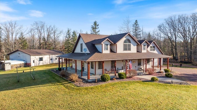 country-style home featuring covered porch and a front yard