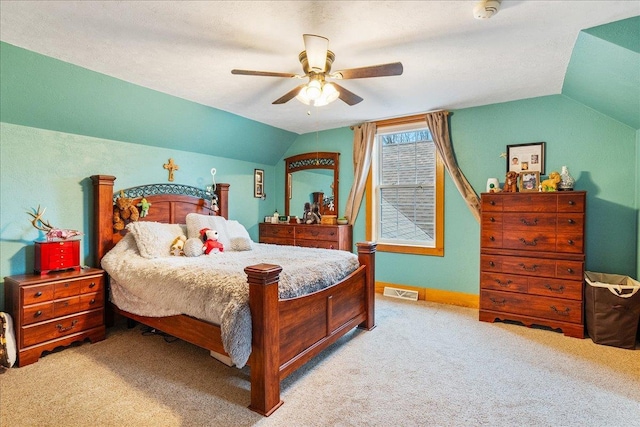 carpeted bedroom with ceiling fan and lofted ceiling