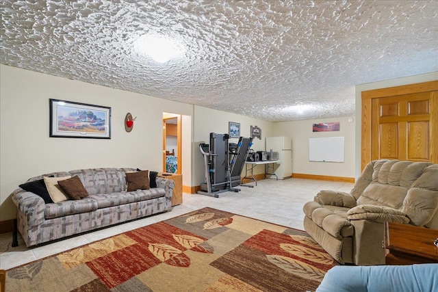 living room featuring carpet and a textured ceiling