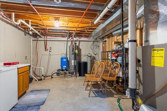 basement with washer / dryer, gas water heater, and heating unit