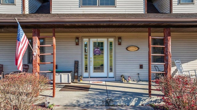 doorway to property featuring covered porch