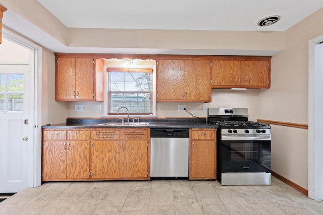 kitchen with sink, stainless steel appliances, and plenty of natural light