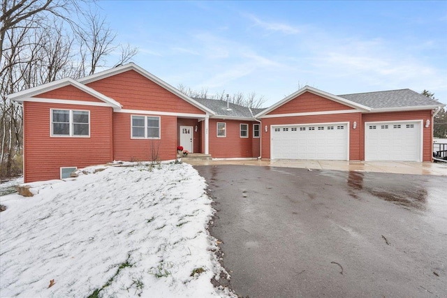 single story home featuring a garage