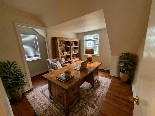 home office featuring dark hardwood / wood-style flooring and lofted ceiling