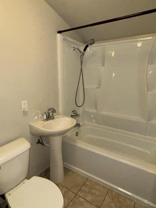 bathroom featuring tile patterned floors,  shower combination, and toilet