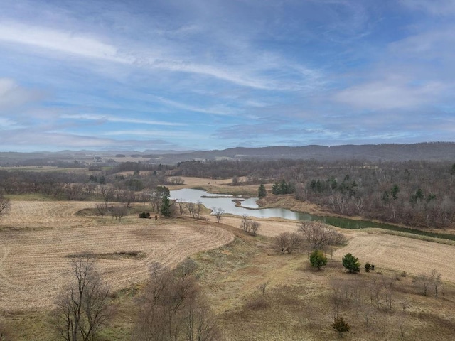 aerial view featuring a water and mountain view