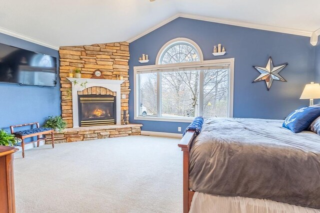 carpeted bedroom with a fireplace, lofted ceiling, and crown molding